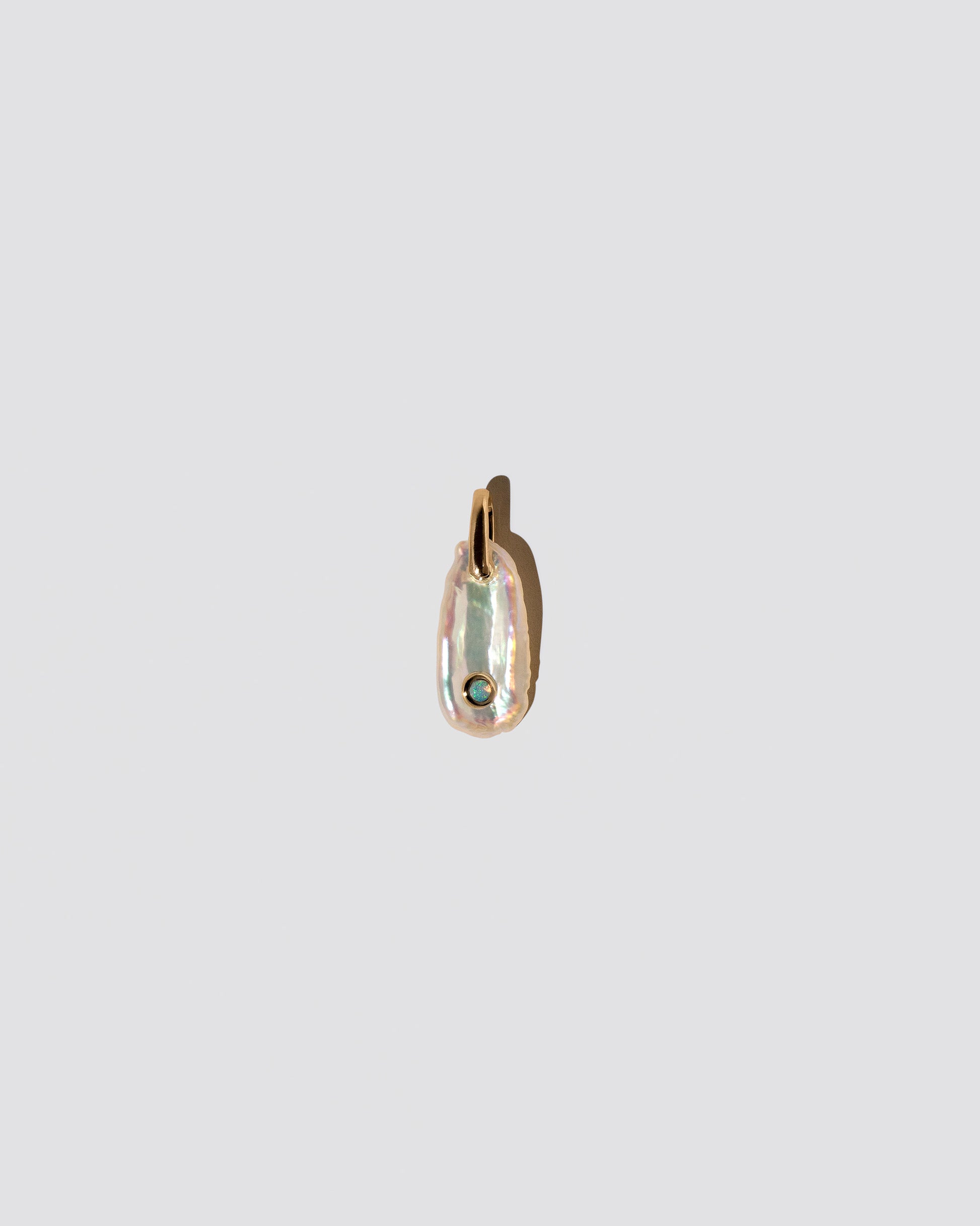 October Birthstone Pearl Pendant With Opal on light color background.