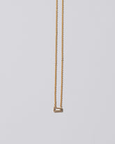 Purity Necklace on light color background.