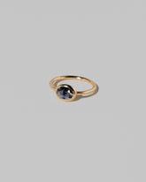 View from the side of the Gusher Blue Sapphire Ring 022 on light color background.