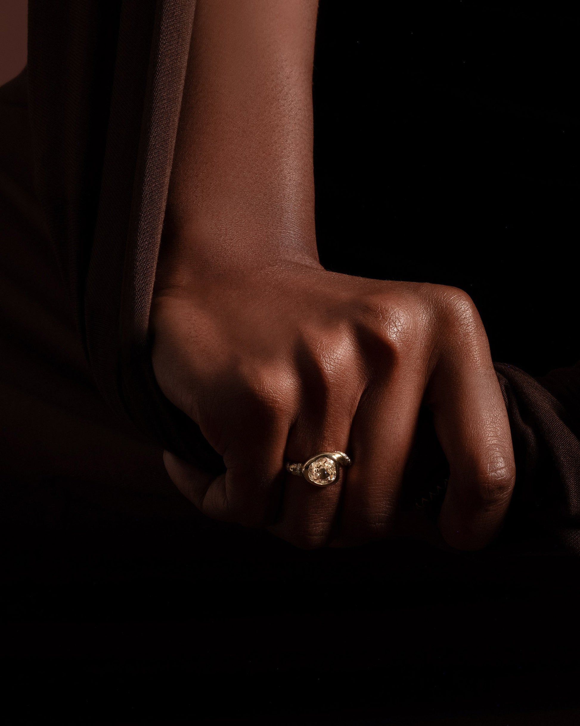 Styled image featuring the Coil Ring on model.