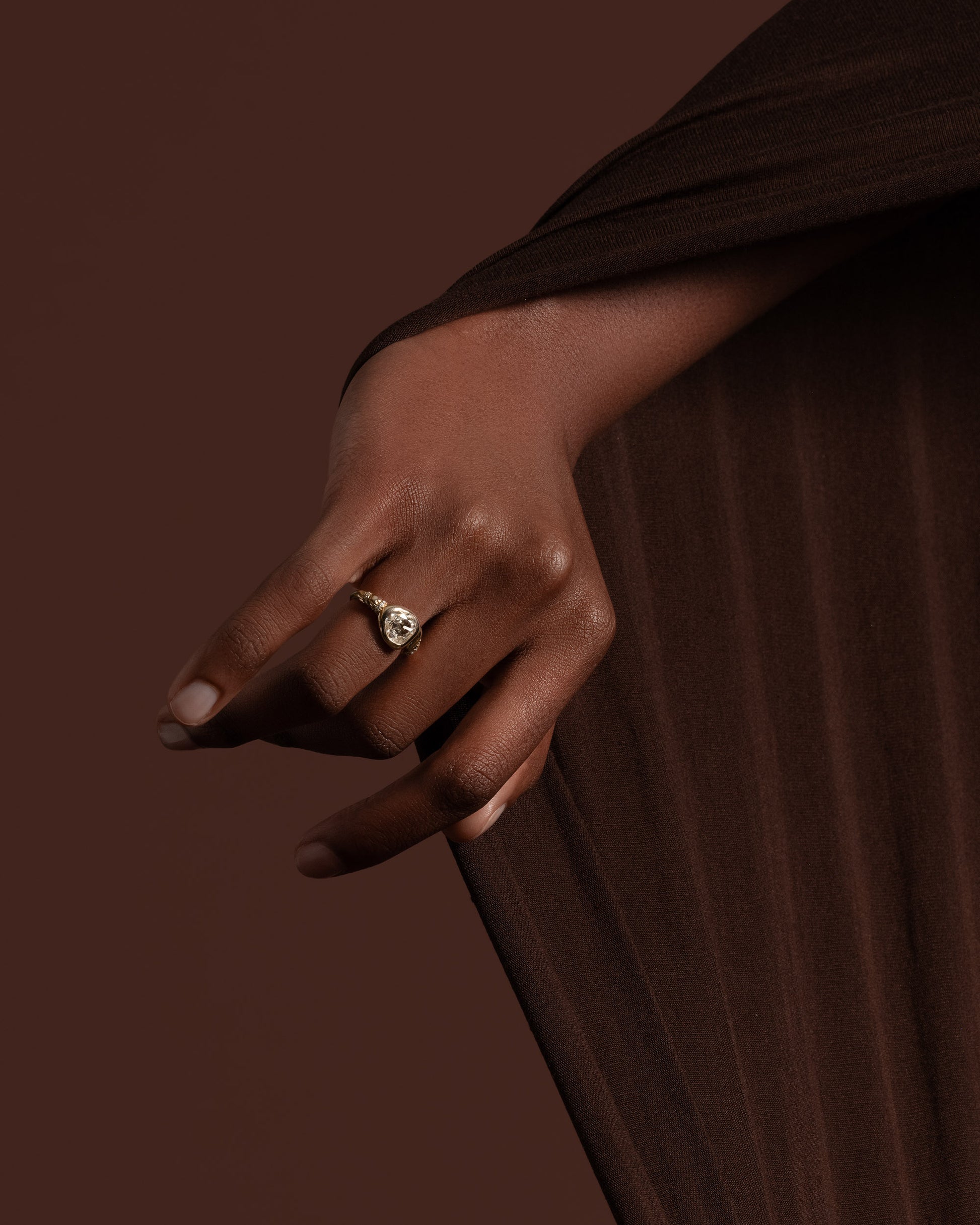 Styled image featuring the Coil Ring on model.