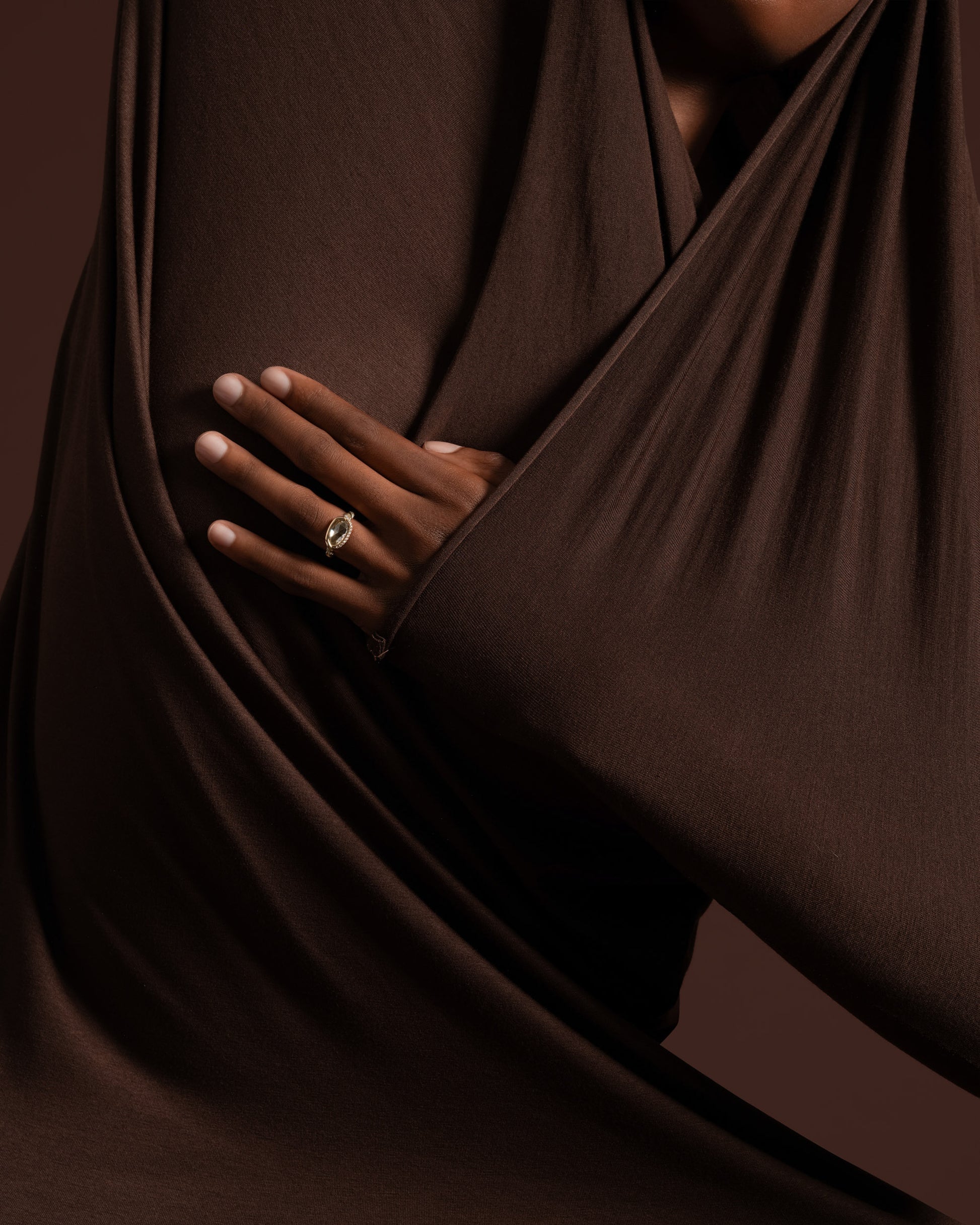 Styled image of the Encircle Ring on model.