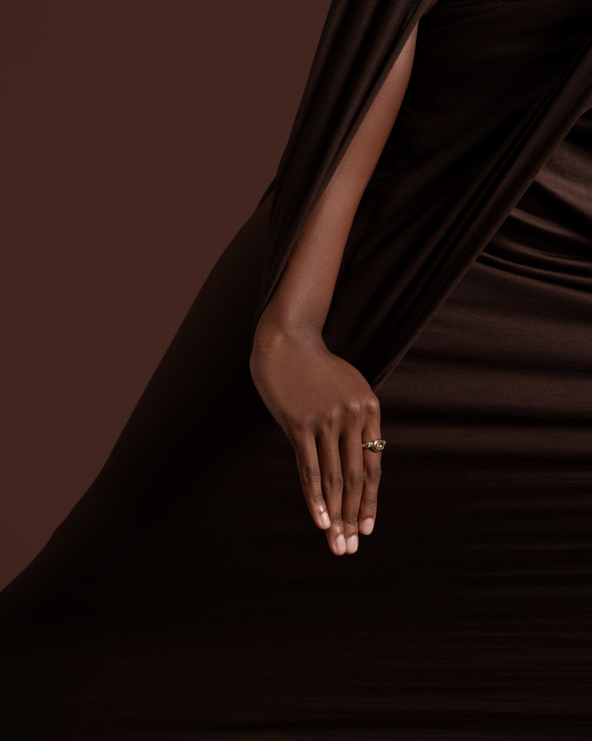 Styled image featuring the Wrapped Ring on model.