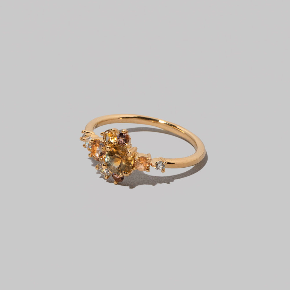 product_details::Closeup details of the Sapphire Anthea Ring on light color background.