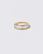 Gold Arcade Ring on light color background.