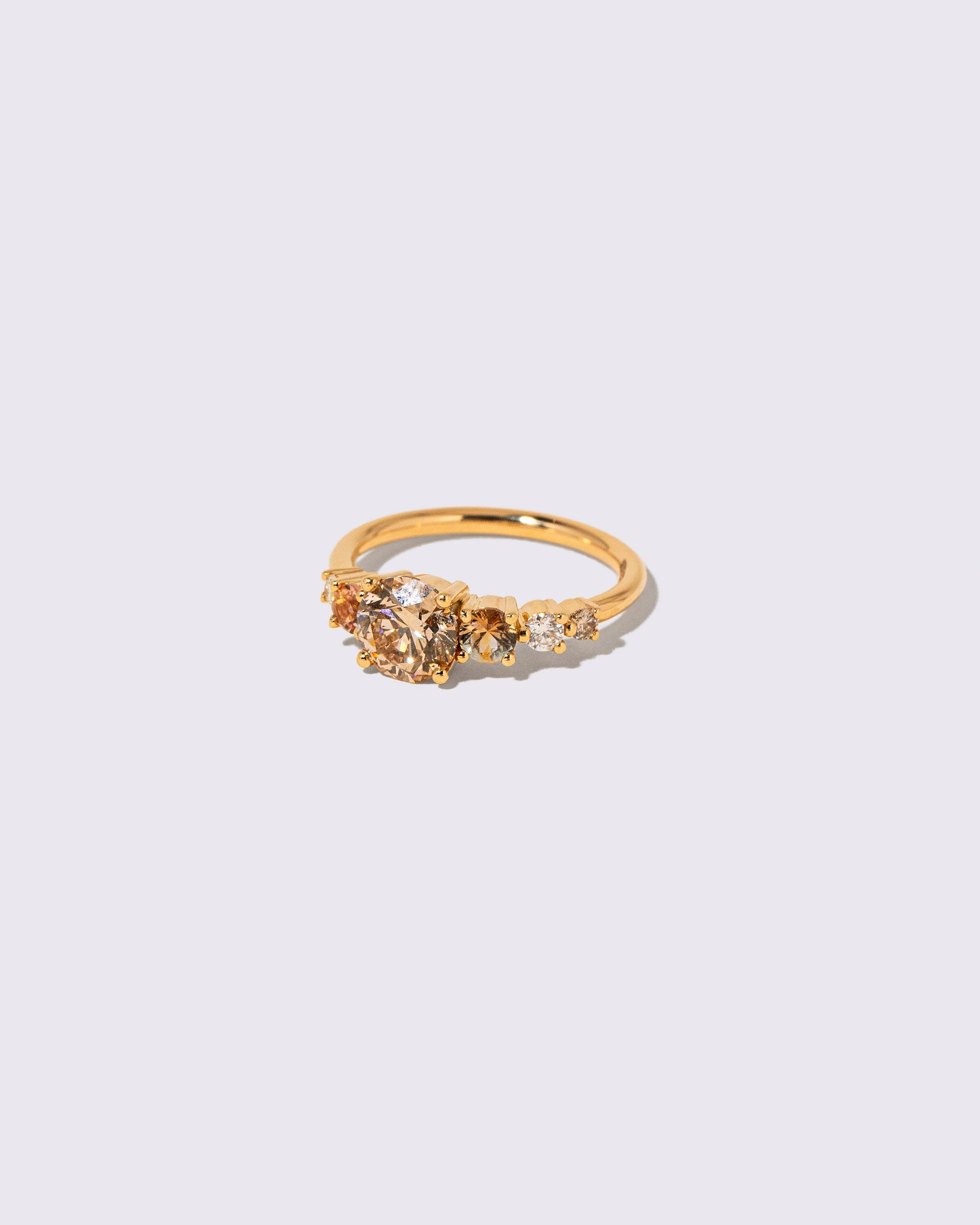 View from the side of the Champagne Diamond Capella Ring on light color background.
