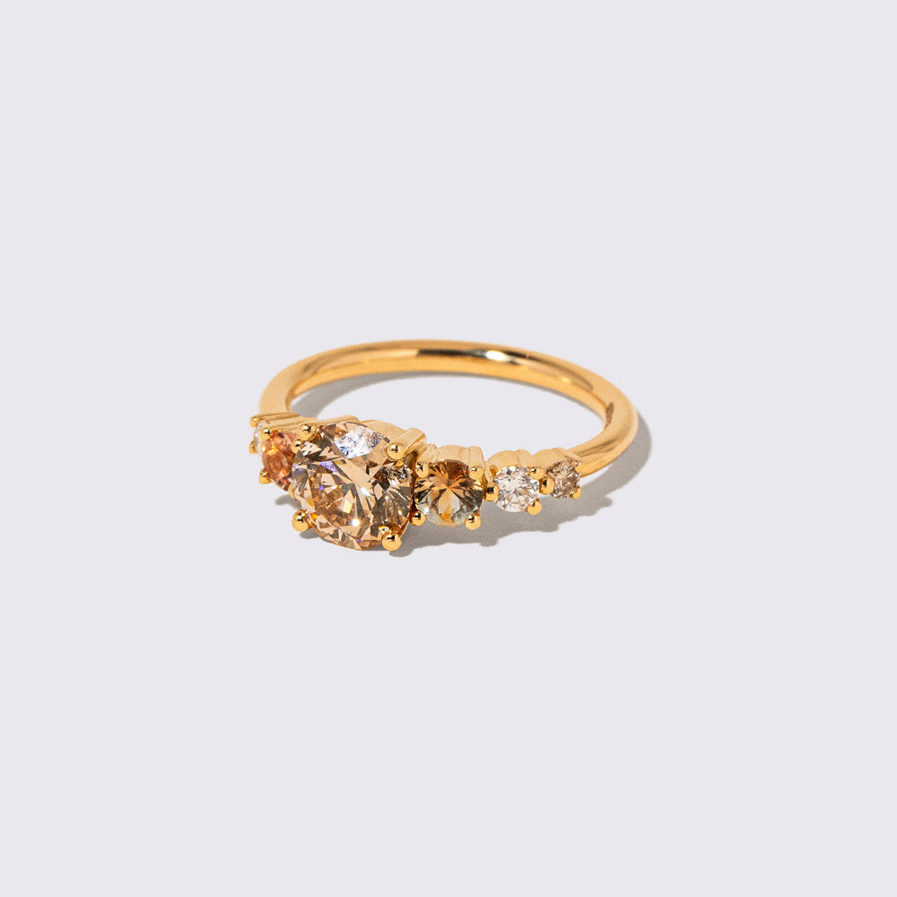 product_details::Closeup details of the Champagne Diamond Capella Ring on light color background.