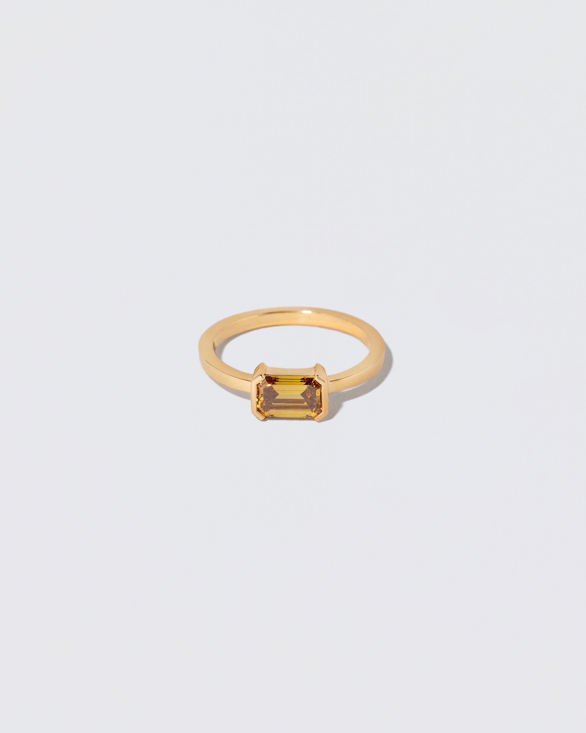 Brown Diamond Courtship Ring on light color background.