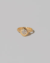 A past edition of the Diamond Poise Ring on light color background.