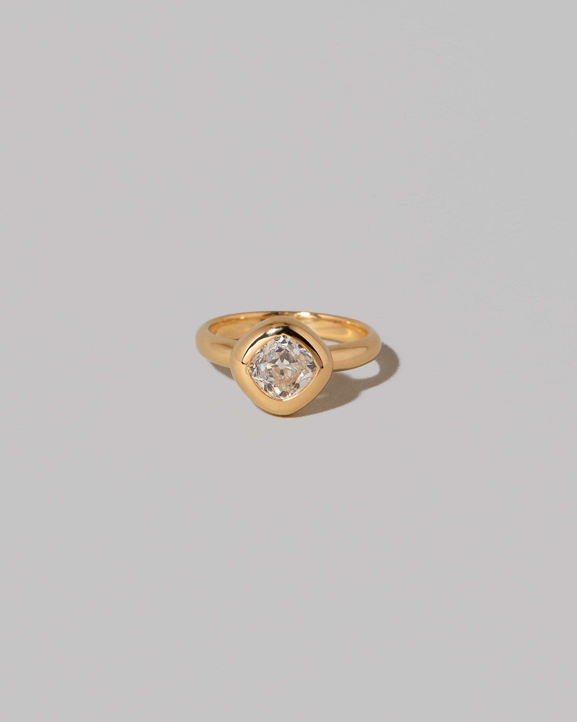 A past edition of the Diamond Poise Ring on light color background.