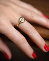 A past edition of the Diamond Poise Ring on model.