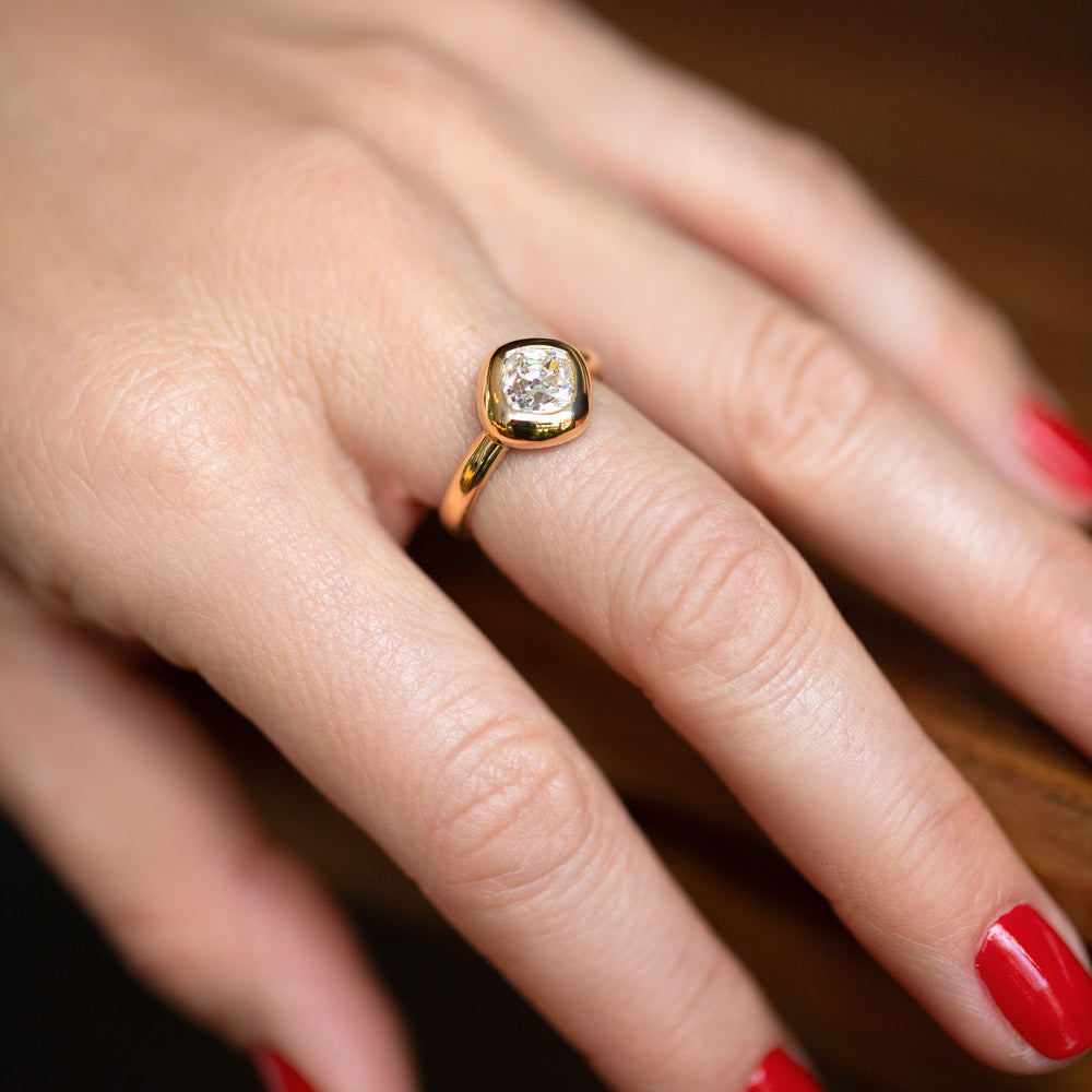 product_details::A past edition of the Diamond Poise Ring on model.