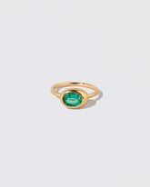 Oval Emerald Equalize Ring on light color background.