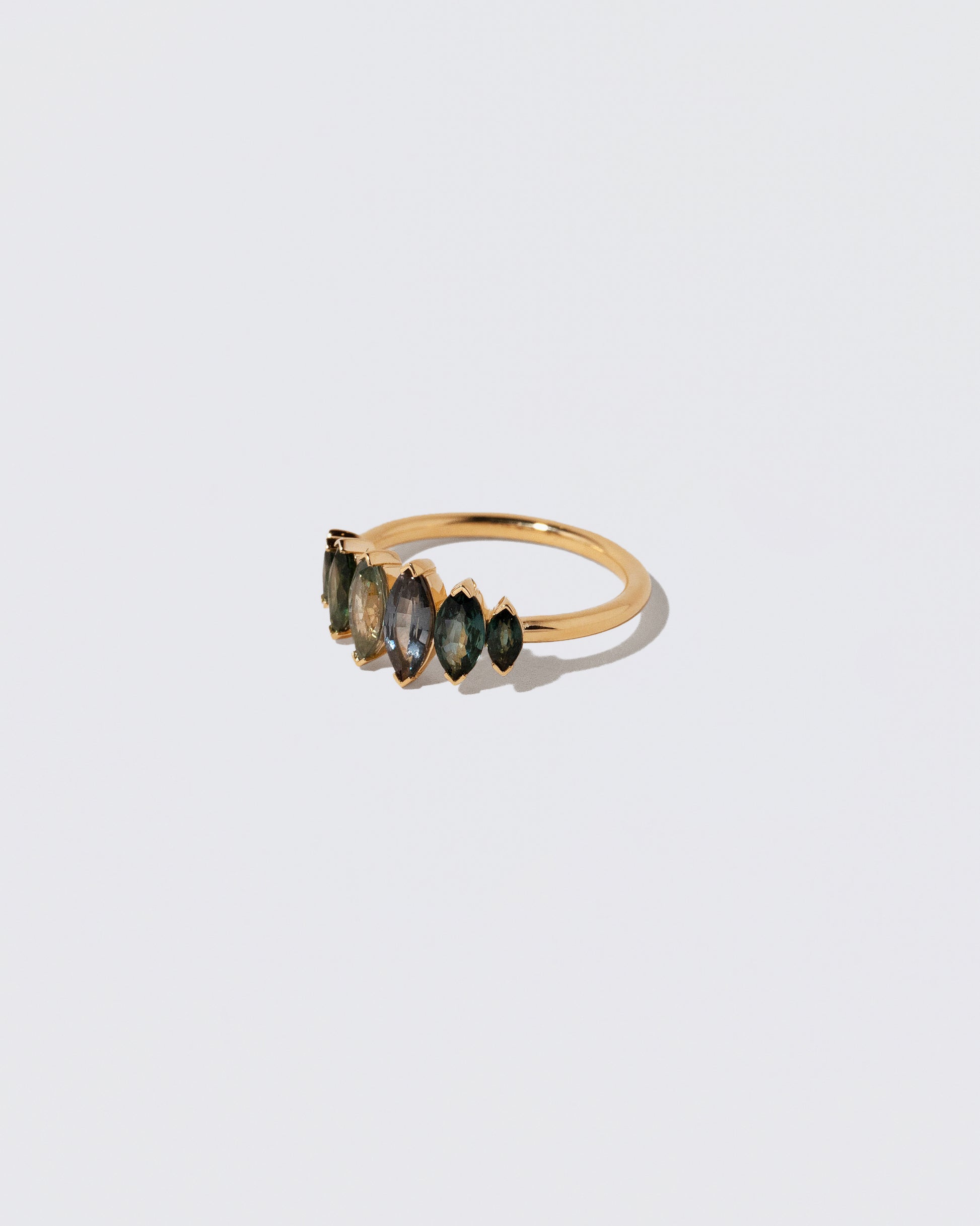 View from the side of the Fritillaria Ring on light color background.