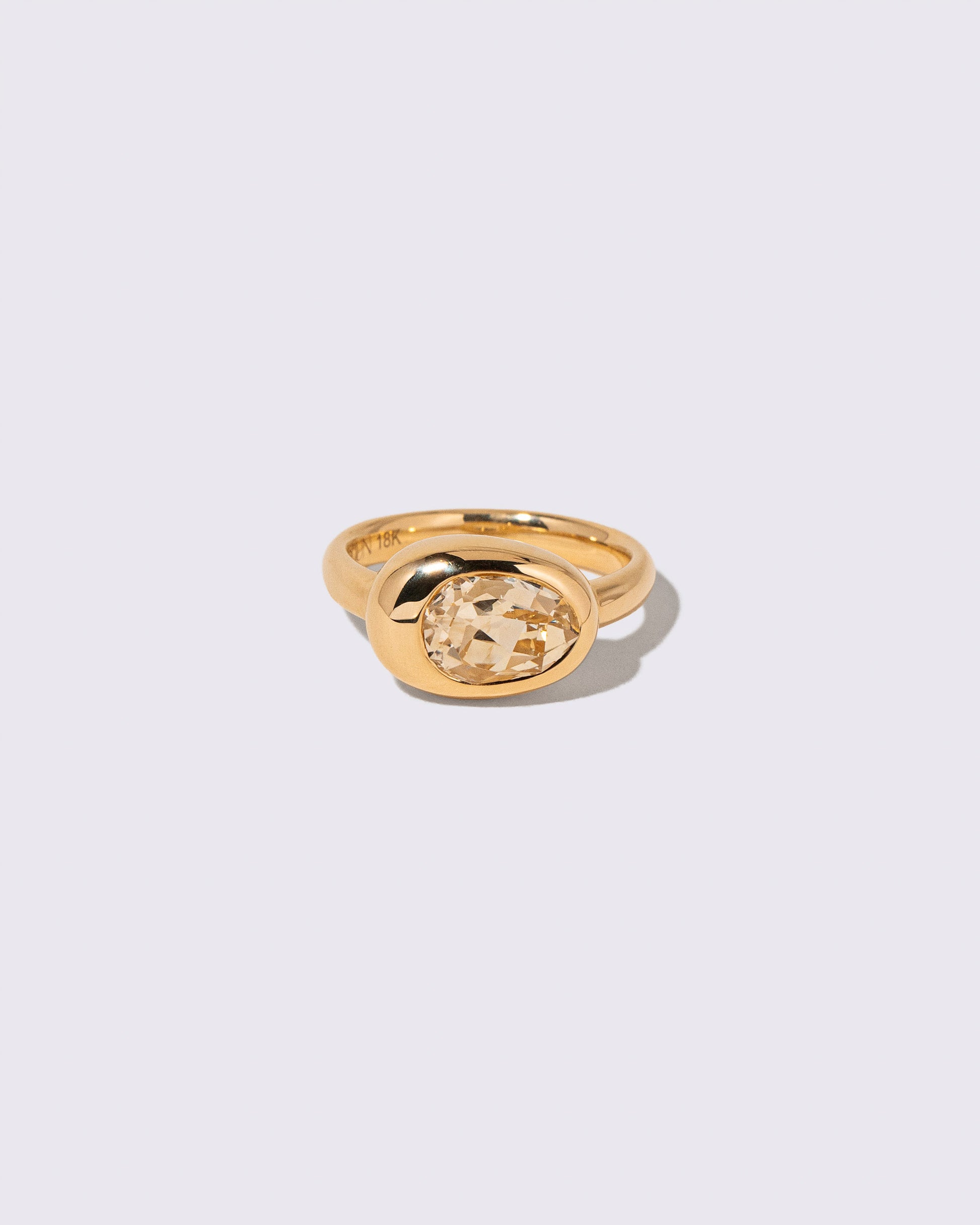 Sapphire Grand Align Ring on light color background.