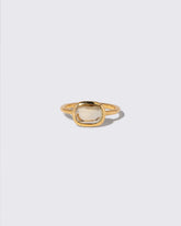 Green Sapphire Gusher Ring on light color background.