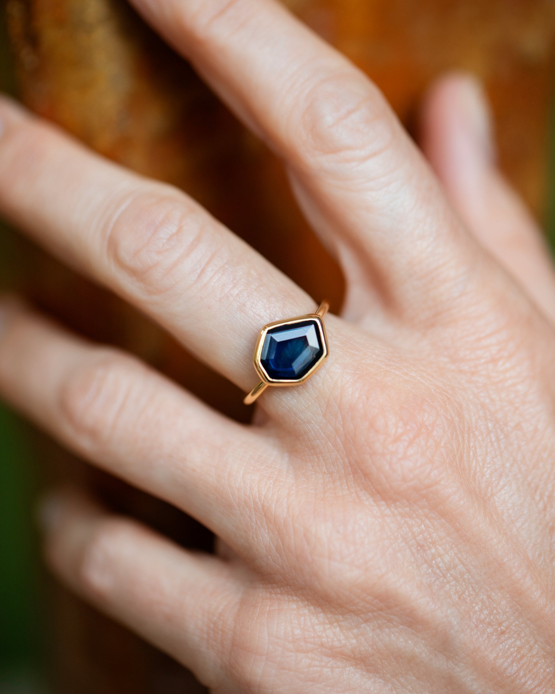 Teal Blue Sapphire Gusher Ring on model.