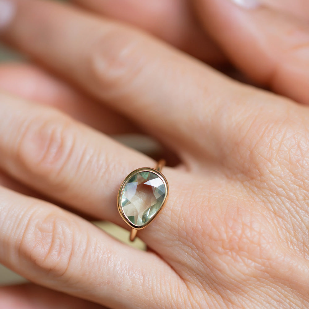 product_details::Green Sapphire Gusher Ring on model.