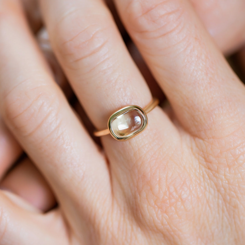 product_details::Green Sapphire Gusher Ring on model.