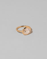 View from the side of the Gusher Diamond Ring 001 on light color background.