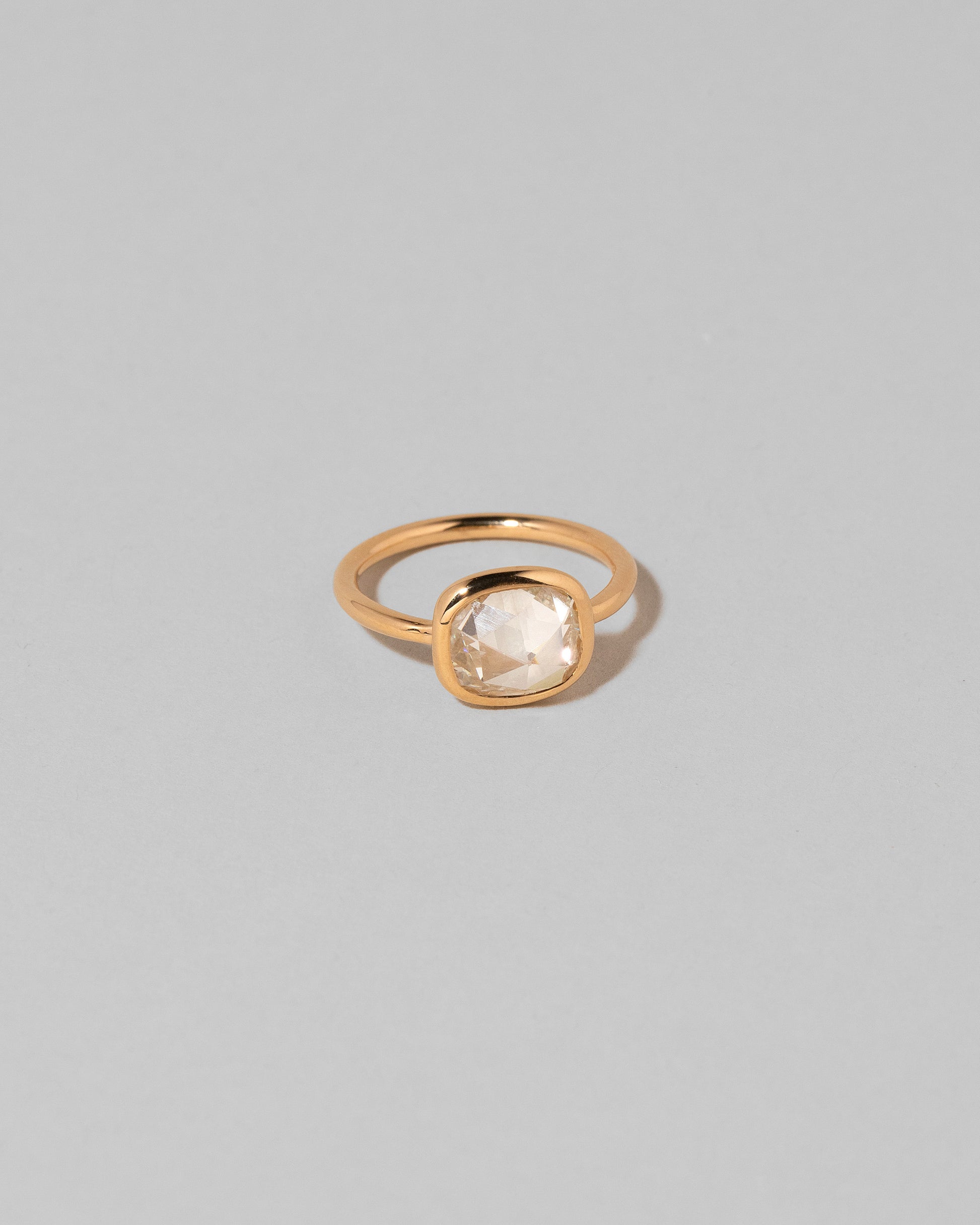 View from the side of the Gusher Diamond Ring 006 on light color background.
