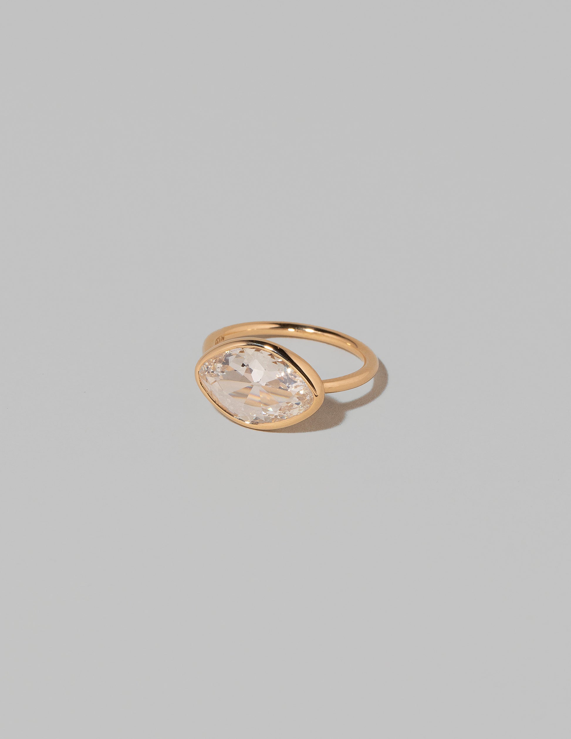 View from the side of the Gusher Diamond Ring 007 on light color background.