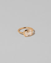 View from the side of the Gusher Diamond Ring 010 on light color background.