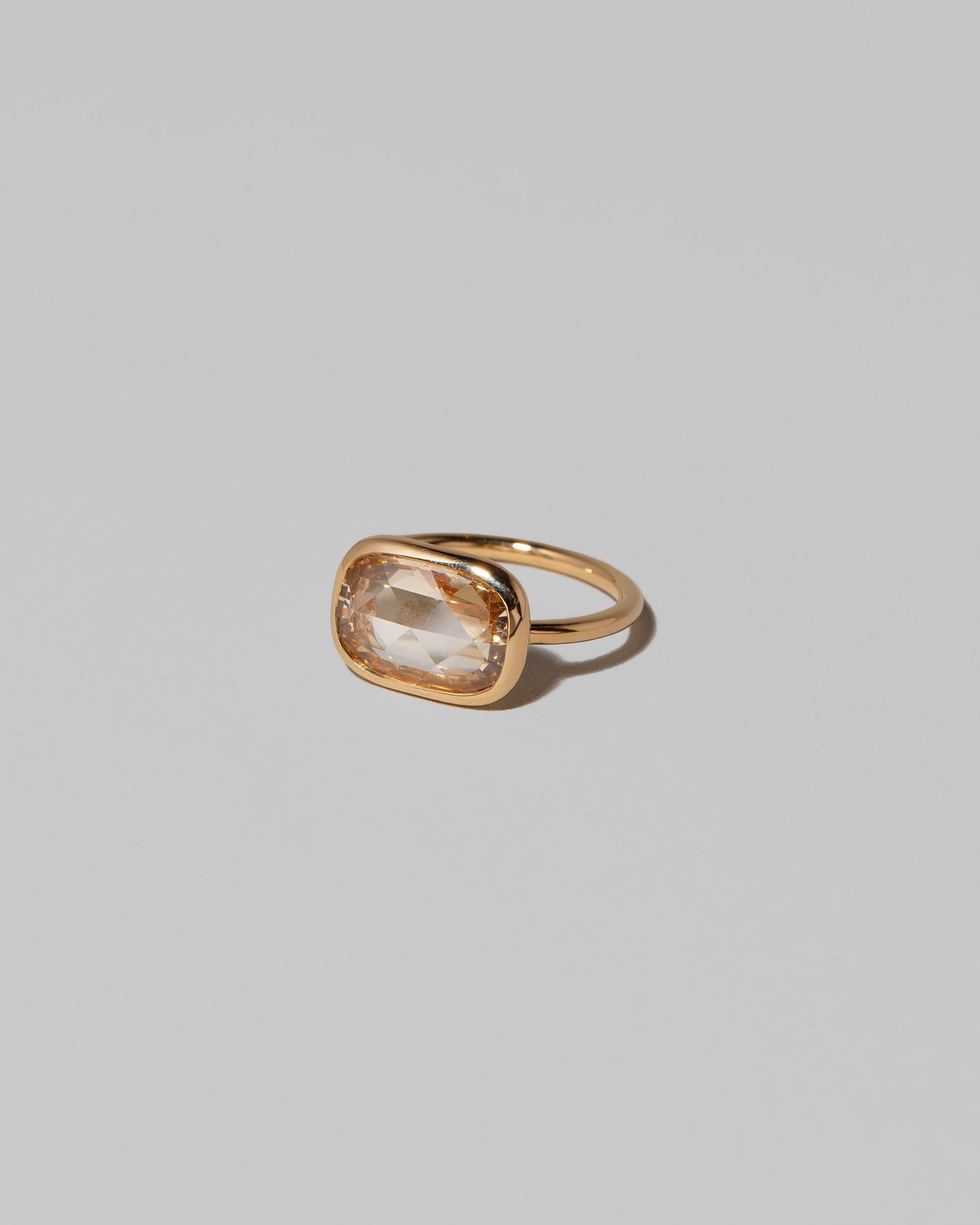 View from the side of the Gusher Diamond Ring 013 on light color background.