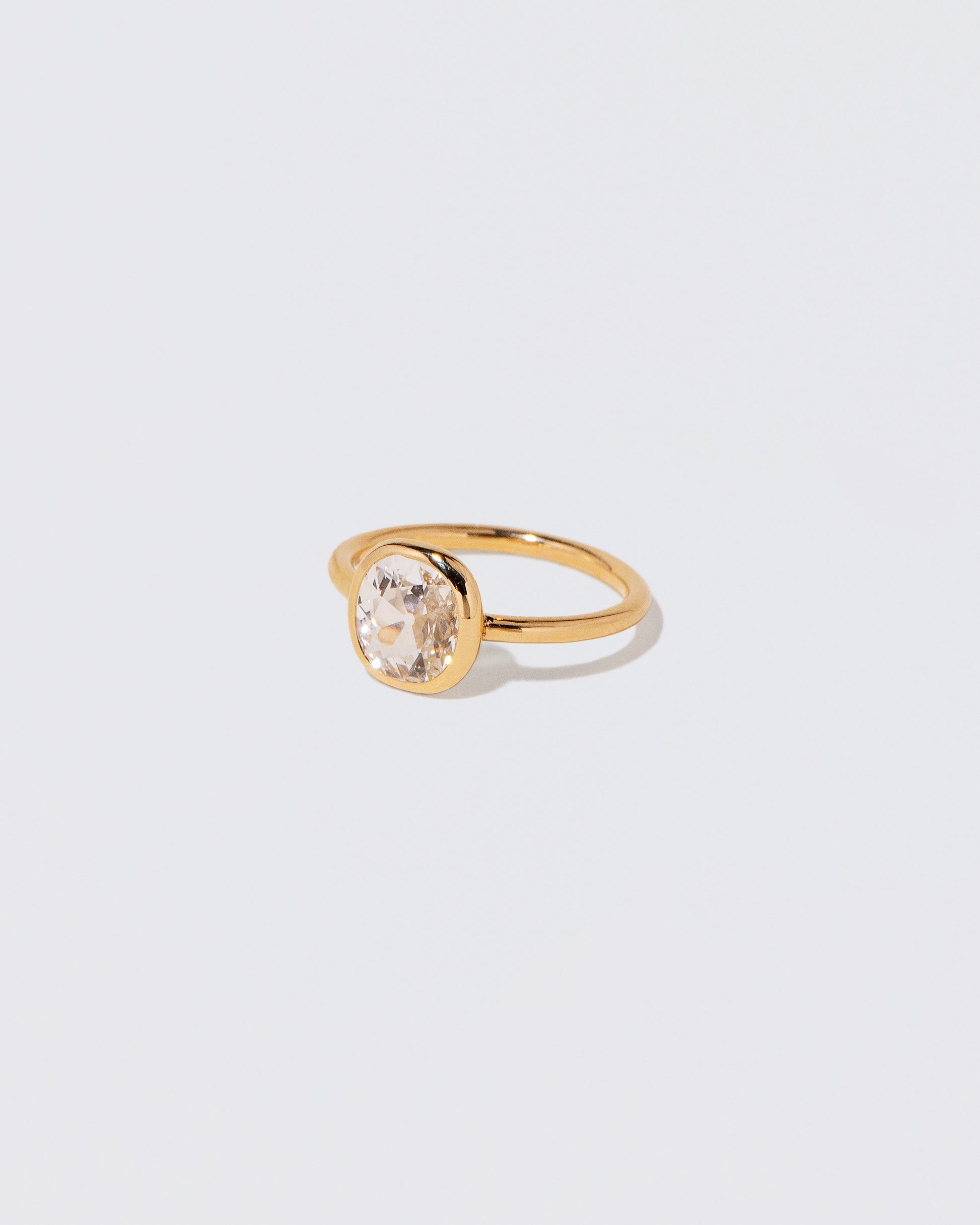 View from the side of the Gusher Diamond Ring 057 on light color background.