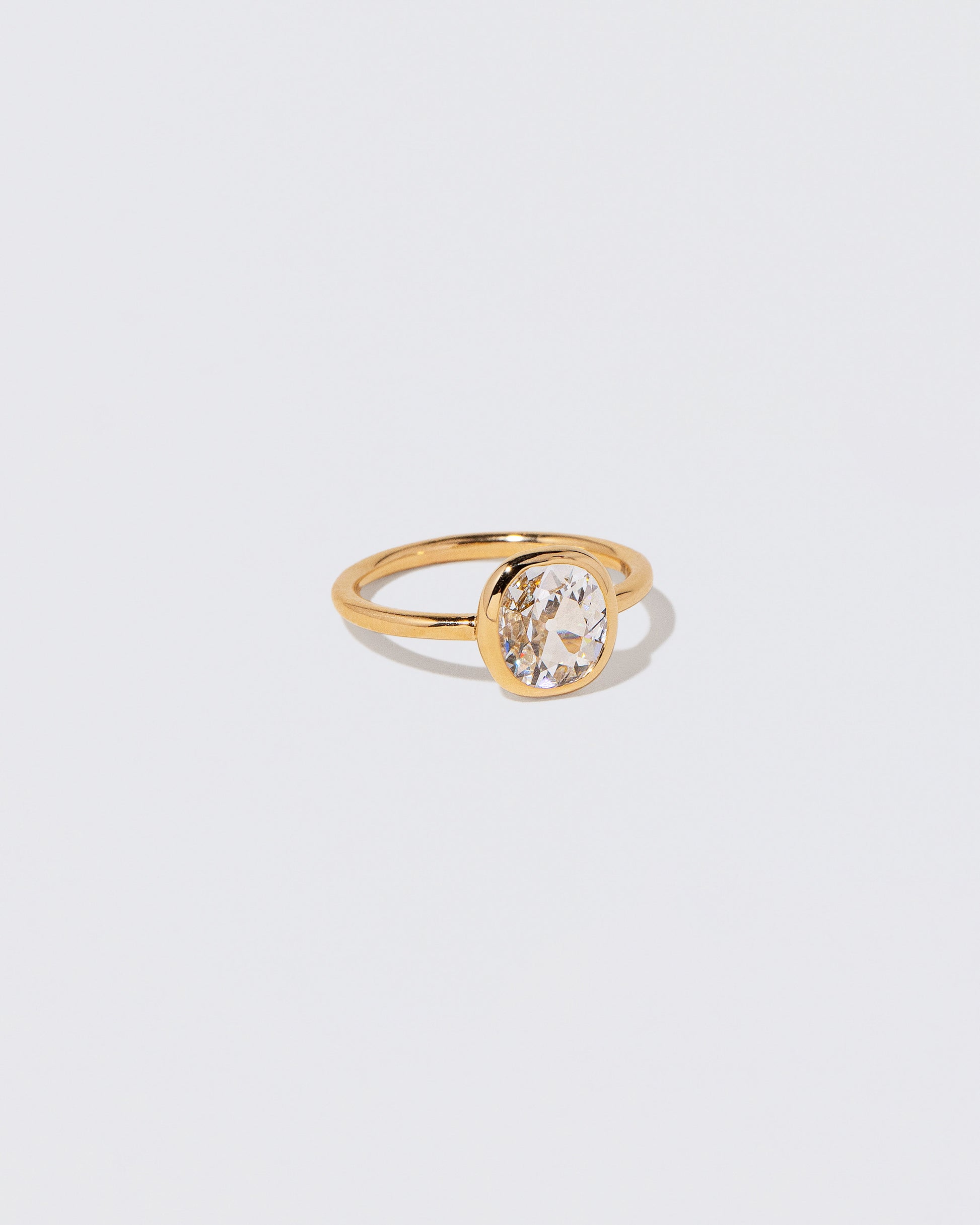 View from the side of the Gusher Diamond Ring 057 on light color background.