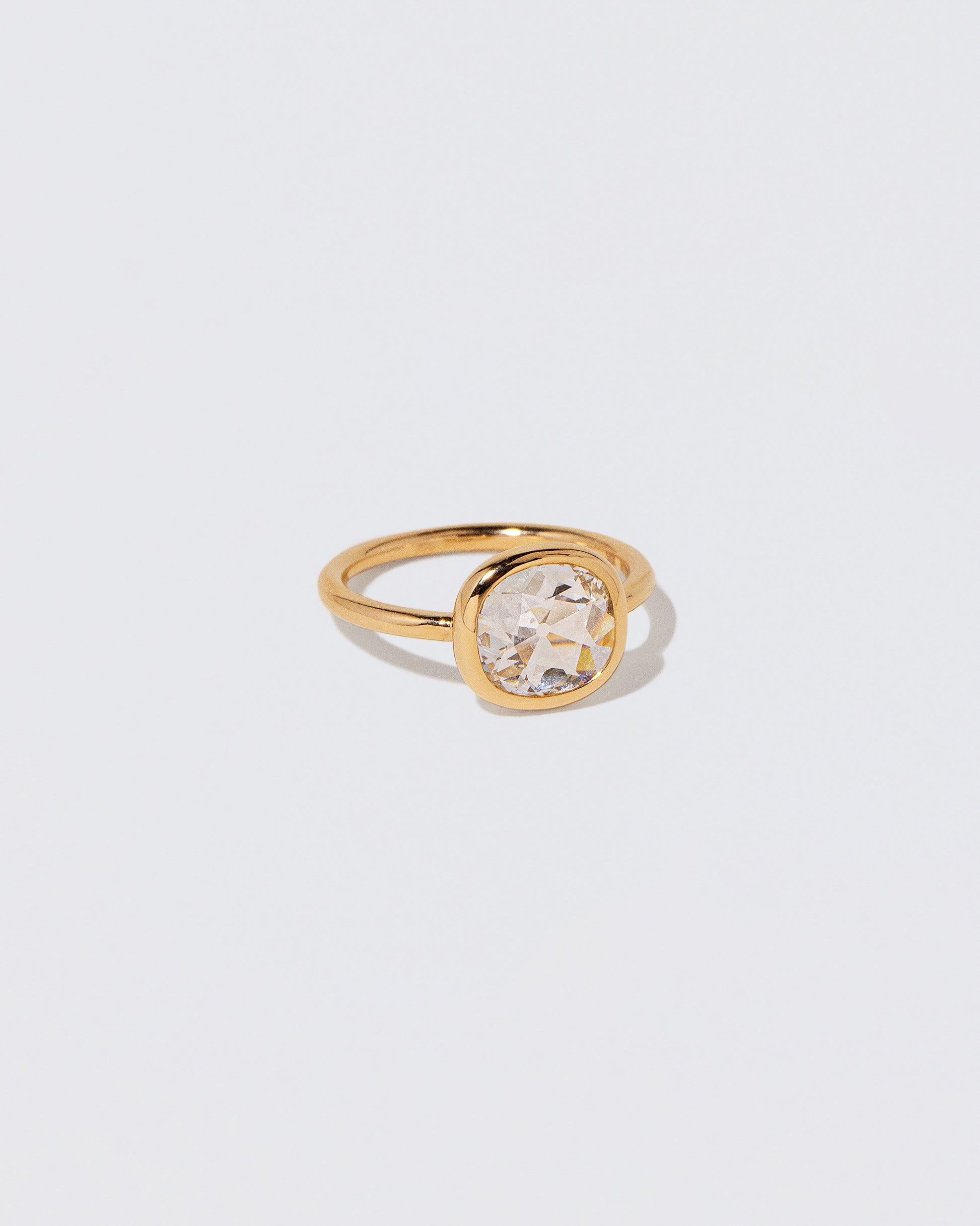 View from the side of the Gusher Diamond Ring 058 on light color background.