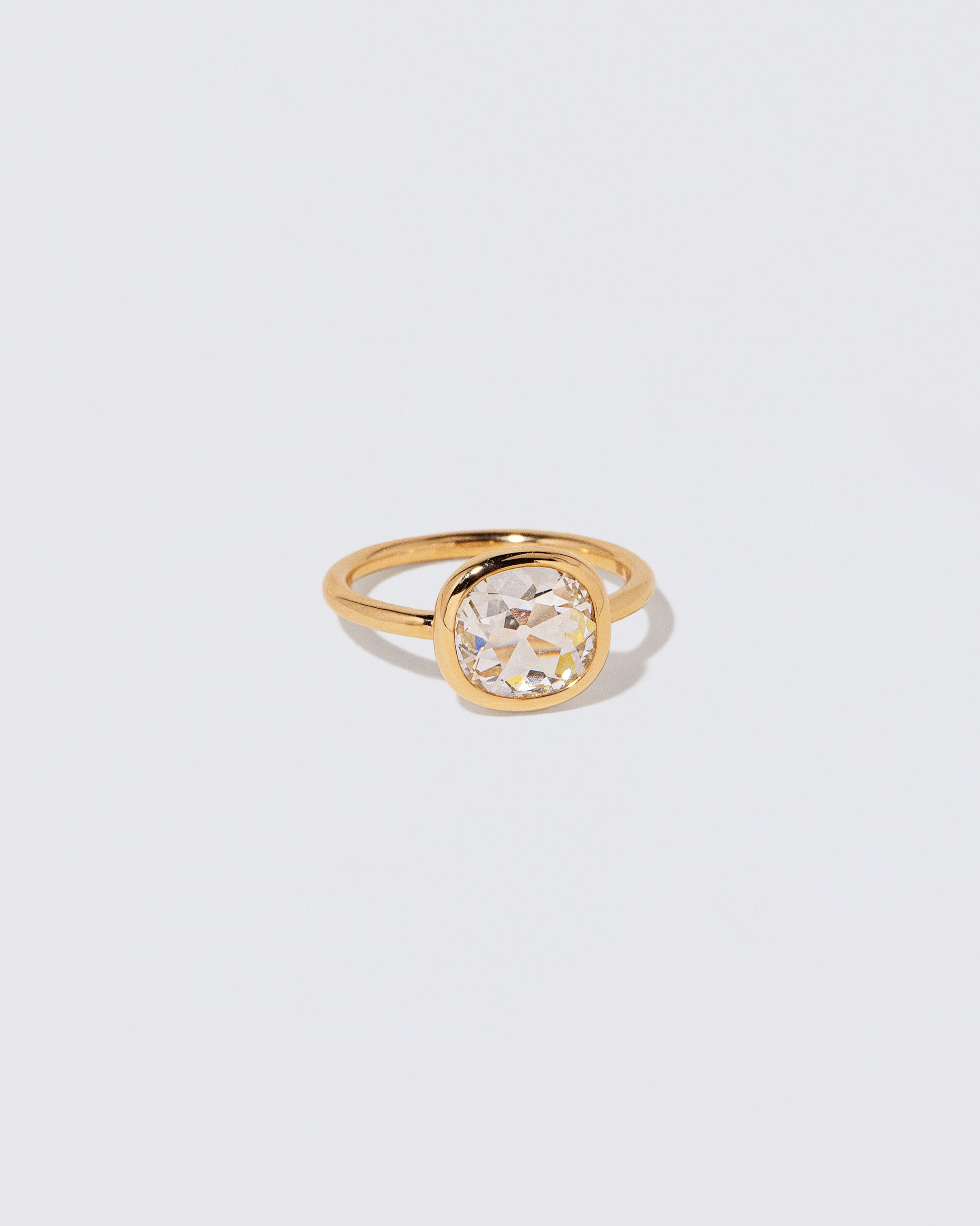 View from the side of the Gusher Diamond Ring 058 on light color background.