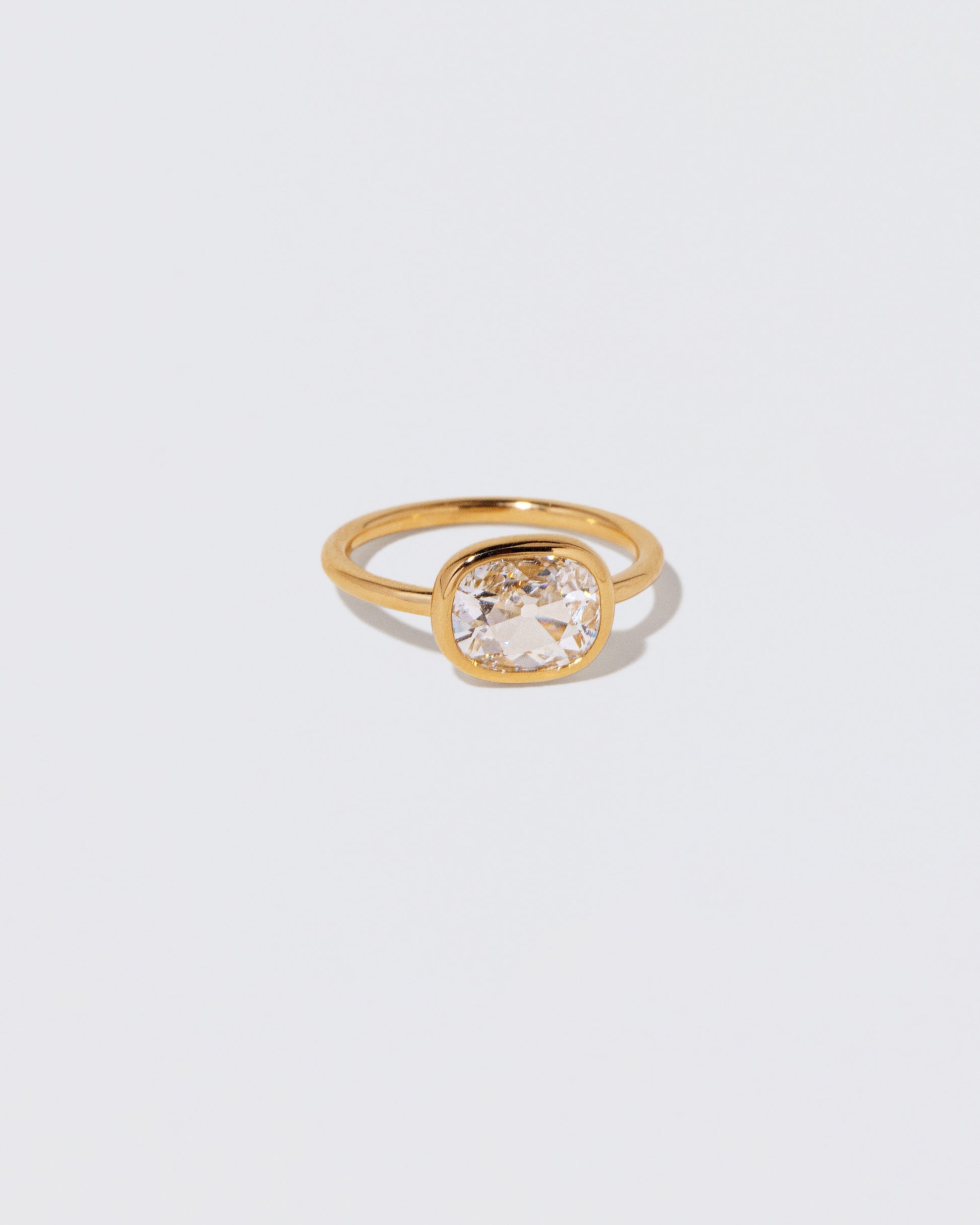 View from the side of the Gusher Diamond Ring 060 on light color background.