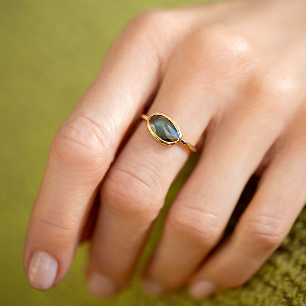 product_details::Gusher Green Sapphire Ring 002 on model.