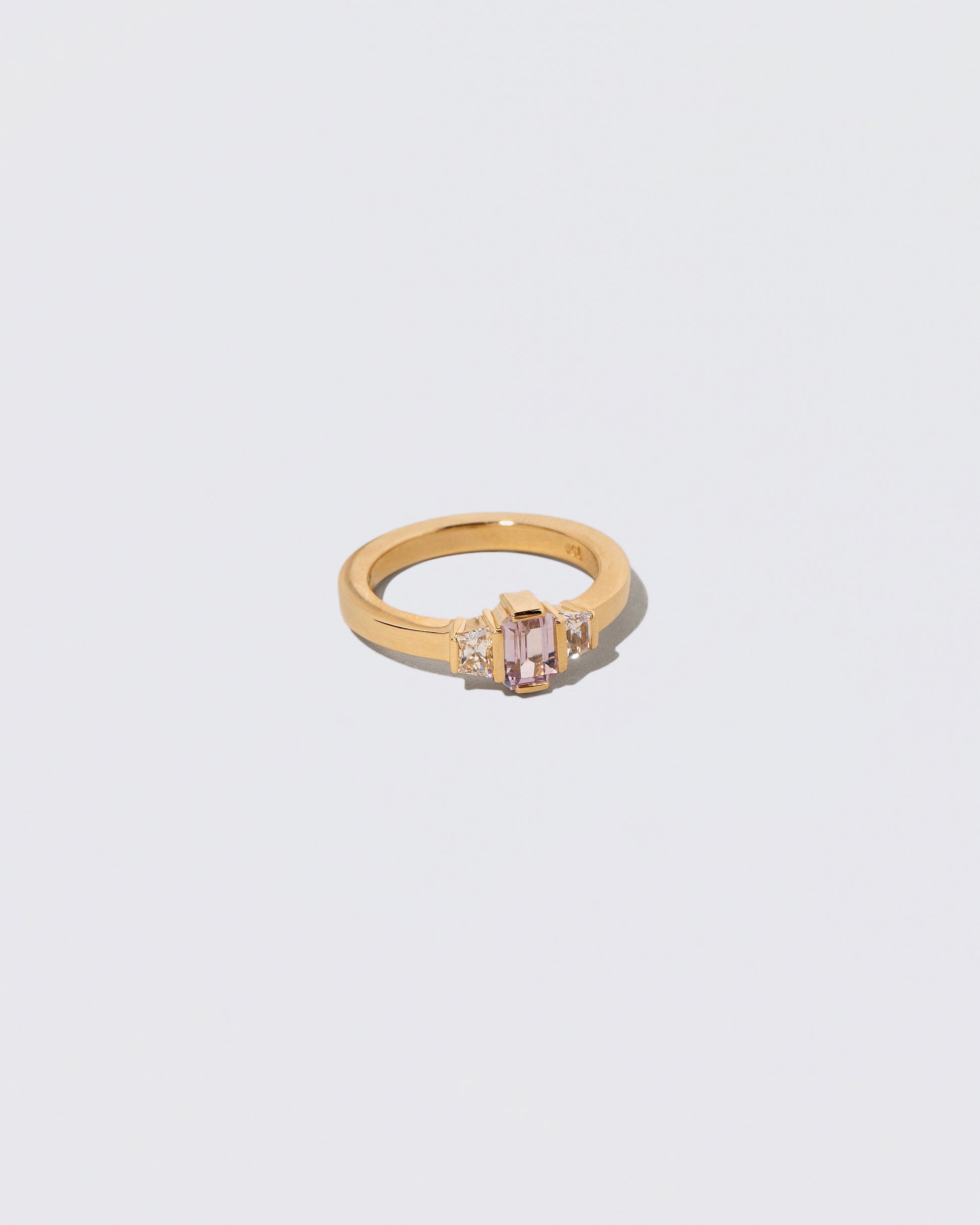 View from the side of the Sweetheart Ring on light color background.