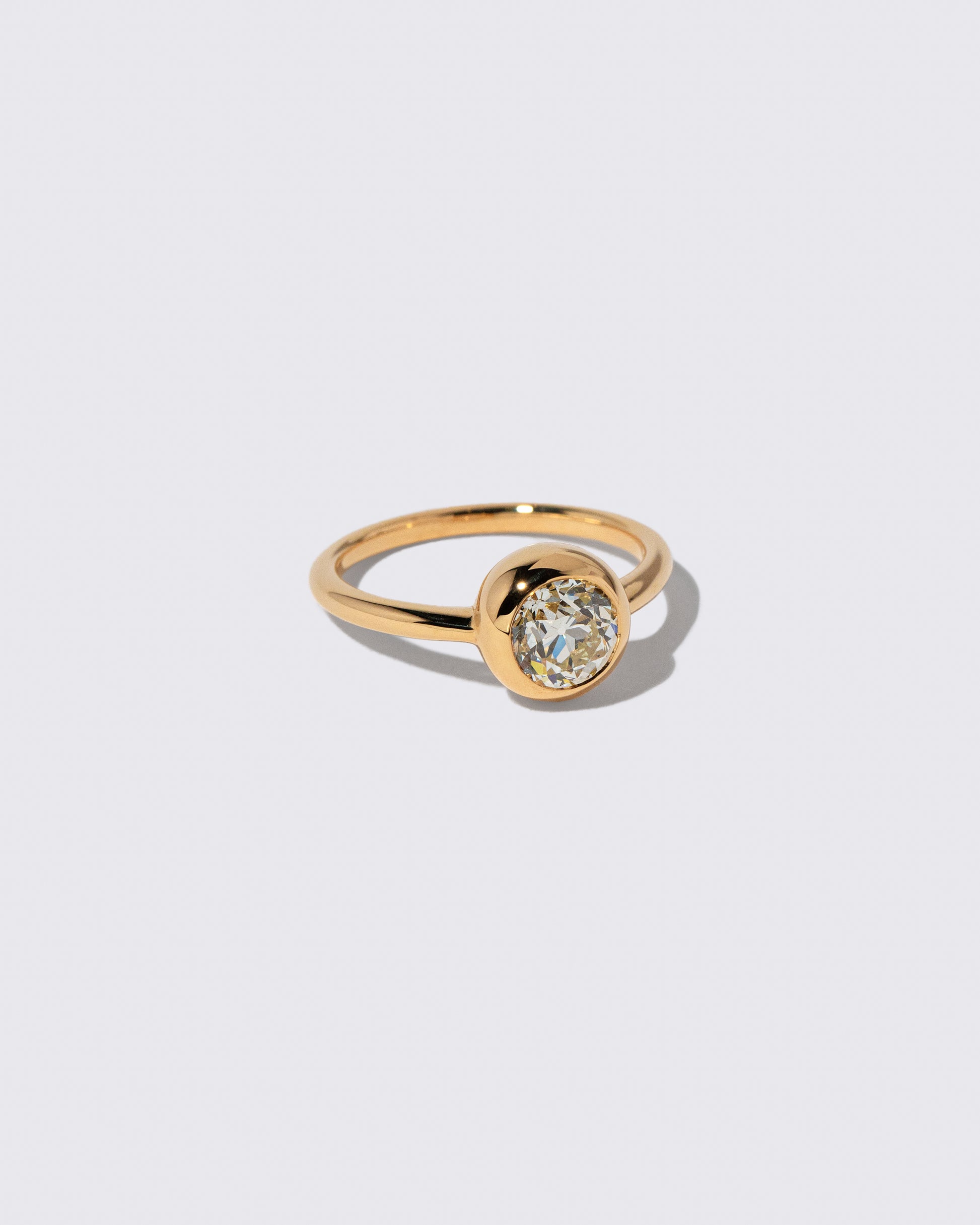 View from the side of the Diamond Wellspring Ring on light color background.