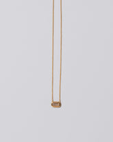 Shah Necklace on light color background.