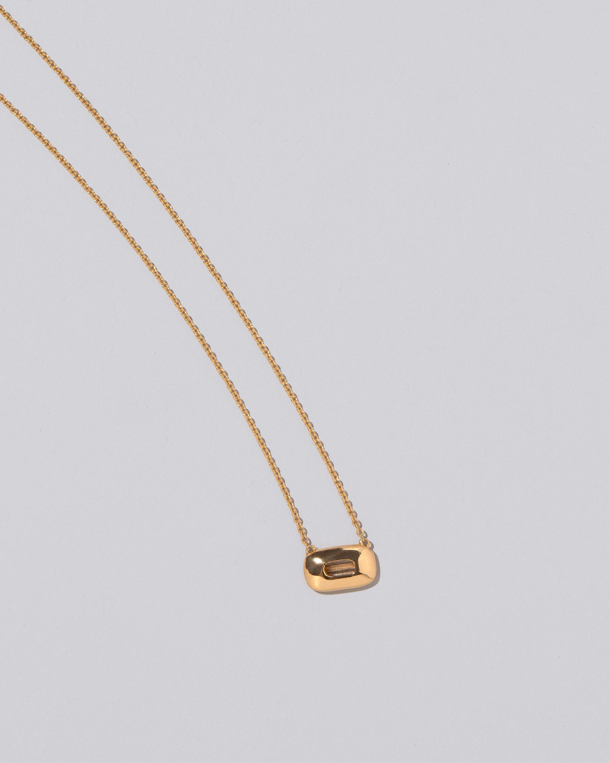 View from the back of the Shah Necklace on light color background.