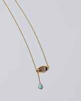 Turquoise State Shifter Necklace on light color background.