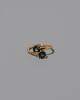 Sapphire Sun & Moon Union Ring on light color background.