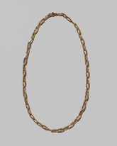 Wavy Link Chain Necklace on light color background.