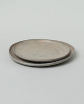 Namu Home Goods Large Zelkova Wood Winter Organic Plate and Namu Home Goods Small Zelkova Wood Winter Organic Plate on light color background.