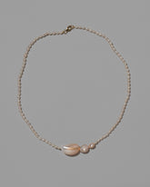 Nereus Pearl Necklace on light color background.