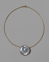 Seeing the Unseen Necklace on light color background.