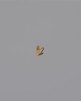 Hand Stud Earring Single on light color background.
