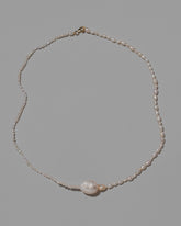 Pontus Pearl Necklace on light color background.