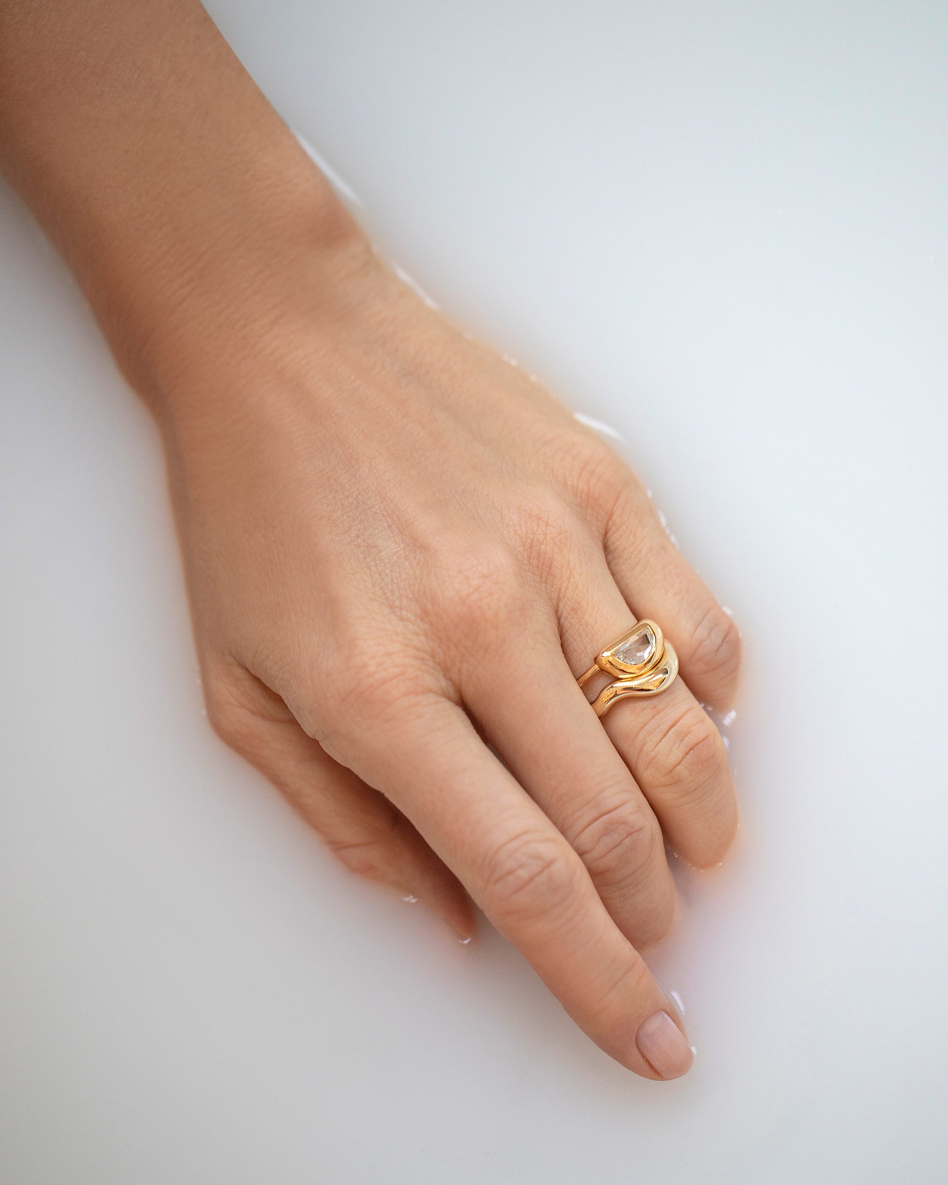 Gold Equate Band and Lined Up Ring on model.