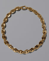 CRZM Gold Bedrock Bracelet on light color background.