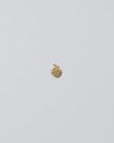 Mini Macaron Charm - Diamond Pavé Pistachio on light color background.