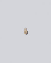 Pavé Blue Egg Charm on light colored background